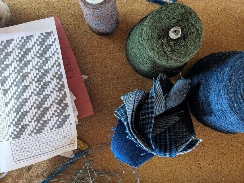 woollen weavng yarn cones and fabric samples at Elvet Woollen Mill